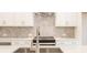 Modern kitchen features white cabinets, white countertops, stainless steel appliances, and tile backsplash at 1979 Deco Dr, Kennesaw, GA 30144