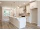 Open concept kitchen with a large island, pendant lighting, and stainless steel appliances at 1979 Deco Dr, Kennesaw, GA 30144