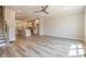 Spacious living room with open floor plan, hardwood floors, modern lighting, and natural light at 1979 Deco Dr, Kennesaw, GA 30144