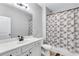 Bathroom featuring a white vanity, modern sink, toilet, and shower with stylish curtain at 385 Hinton Chase Pkwy, Covington, GA 30016
