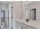 Well-lit bathroom featuring a white vanity with modern fixtures and a large mirror at 385 Hinton Chase Pkwy, Covington, GA 30016