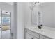Bathroom with a white vanity, large mirror, and modern fixtures at 385 Hinton Chase Pkwy, Covington, GA 30016