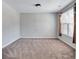 Spacious bedroom featuring neutral carpet, window, and natural light at 385 Hinton Chase Pkwy, Covington, GA 30016