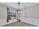 Dining room with neutral carpet, wainscoting, chandelier, and lots of natural light at 385 Hinton Chase Pkwy, Covington, GA 30016