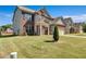 Beautiful two-story home with brick and siding, a well-kept lawn, and a two-car garage at 385 Hinton Chase Pkwy, Covington, GA 30016