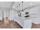 Modern kitchen featuring a central island, stainless appliances, and granite countertops at 385 Hinton Chase Pkwy, Covington, GA 30016