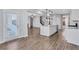 Open concept kitchen with island, stainless appliances, and access to backyard at 385 Hinton Chase Pkwy, Covington, GA 30016