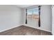 Bright room with wood flooring, a large window, and neutral colored walls at 385 Hinton Chase Pkwy, Covington, GA 30016
