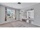 Cozy living room with hardwood flooring, neutral walls, and plenty of natural light at 385 Hinton Chase Pkwy, Covington, GA 30016