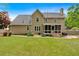 Expansive backyard featuring a screened-in porch and lush lawn at 4067 Silver Fir Ct, Marietta, GA 30066