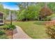 Lush backyard featuring a hammock, fire pit, and well-manicured lawn at 4067 Silver Fir Ct, Marietta, GA 30066