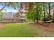 Spacious backyard with a hammock strung between trees for relaxing at 4067 Silver Fir Ct, Marietta, GA 30066
