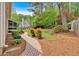 Beautiful backyard with a brick pathway leading to a cozy outdoor space at 4067 Silver Fir Ct, Marietta, GA 30066