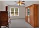 Spacious bedroom with ample closet space, ceiling fan, and bright window at 4067 Silver Fir Ct, Marietta, GA 30066