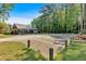 Community clubhouse with ample parking and seating surrounded by mature trees on a beautiful sunny day at 4067 Silver Fir Ct, Marietta, GA 30066