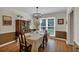 This dining room features a decorative chandelier and a large window for natural light at 4067 Silver Fir Ct, Marietta, GA 30066