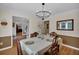 Traditional dining room showcasing wainscoting, chandelier and an open floor plan at 4067 Silver Fir Ct, Marietta, GA 30066