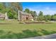 Traditional brick home with a two-car garage and landscaped front yard, set on a spacious lot with mature trees at 4067 Silver Fir Ct, Marietta, GA 30066