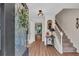 Inviting foyer with hardwood floors, staircase, decorative mirror, and an open view into other rooms at 4067 Silver Fir Ct, Marietta, GA 30066