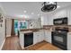 Bright kitchen with granite countertops, stainless steel appliances and a view to the backyard at 4067 Silver Fir Ct, Marietta, GA 30066
