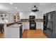Modern kitchen featuring white cabinets, stainless steel appliances, and granite countertops at 4067 Silver Fir Ct, Marietta, GA 30066