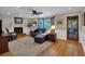 Inviting living room featuring a fireplace, wood floors, and a comfortable seating area at 4067 Silver Fir Ct, Marietta, GA 30066