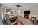 Living room with built in bookcases, ceiling fan and cozy seating offers a comfortable space at 4067 Silver Fir Ct, Marietta, GA 30066