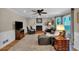 Cozy living room with fireplace, ceiling fan, and hardwood floors provides a relaxing atmosphere at 4067 Silver Fir Ct, Marietta, GA 30066
