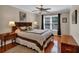 Comfortable main bedroom with hardwood floors, ceiling fan, and natural light at 4067 Silver Fir Ct, Marietta, GA 30066