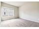 Carpeted bedroom showcasing a bright window offering natural light into the space at 510 Suwanee Pass Ln, Suwanee, GA 30024