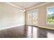 Bright dining area with french doors and hardwood flooring at 510 Suwanee Pass Ln, Suwanee, GA 30024
