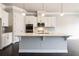 Kitchen with large center island, pendant lighting, and stainless steel appliances at 510 Suwanee Pass Ln, Suwanee, GA 30024