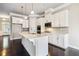 Well-lit kitchen features a center island, stainless appliances, and ample cabinet space at 510 Suwanee Pass Ln, Suwanee, GA 30024