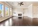 Inviting living room with hardwood floors, fireplace, built-in shelving, and ample natural light at 510 Suwanee Pass Ln, Suwanee, GA 30024