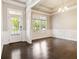 Bright living room with hardwood floors, and large windows offering natural light and a view at 510 Suwanee Pass Ln, Suwanee, GA 30024