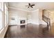 Bright living room features a fireplace, built-in bookshelves, and hardwood floors at 510 Suwanee Pass Ln, Suwanee, GA 30024