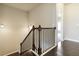 Staircase with decorative wrought iron railing at 510 Suwanee Pass Ln, Suwanee, GA 30024