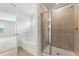 Well-lit bathroom featuring a glass-enclosed shower and a separate soaking tub at 7145 Brushwood Bend - Lot 41, Lithonia, GA 30058