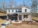 An inviting two-story home with a stone facade and a covered entrance makes for a beautiful property at 7145 Brushwood Bend - Lot 41, Lithonia, GA 30058