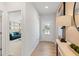 A bright entryway leads to a modern living space, highlighted by sleek floors and a contemporary design at 7145 Brushwood Bend - Lot 41, Lithonia, GA 30058