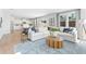 Spacious living area featuring a comfortable white sectional and open kitchen access at 7145 Brushwood Bend - Lot 41, Lithonia, GA 30058
