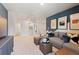 Upstairs recreation area features a large sectional, and a convenient bathroom at 7145 Brushwood Bend - Lot 41, Lithonia, GA 30058