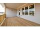 Covered back porch with wood flooring and view of surrounding neighborhood at 1903 Deco Dr, Kennesaw, GA 30144