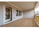 Covered back porch featuring wood floors and access to interior of home at 1903 Deco Dr, Kennesaw, GA 30144