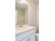 Clean bathroom with a white single sink vanity, mirror, and a shower with tub combination at 1903 Deco Dr, Kennesaw, GA 30144