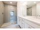 Elegant bathroom featuring double sinks, framed mirrors, and a glass enclosed shower at 1903 Deco Dr, Kennesaw, GA 30144