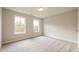 Bedroom with neutral carpet, two large windows and neutral paint at 1903 Deco Dr, Kennesaw, GA 30144