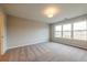 Spacious bedroom featuring large windows and neutral carpet, ideal for relaxation at 1903 Deco Dr, Kennesaw, GA 30144