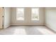 Bedroom with two windows and neutral carpet at 1903 Deco Dr, Kennesaw, GA 30144