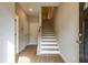 Bright entryway showcasing wood flooring, staircase with white risers, and neutral walls at 1903 Deco Dr, Kennesaw, GA 30144